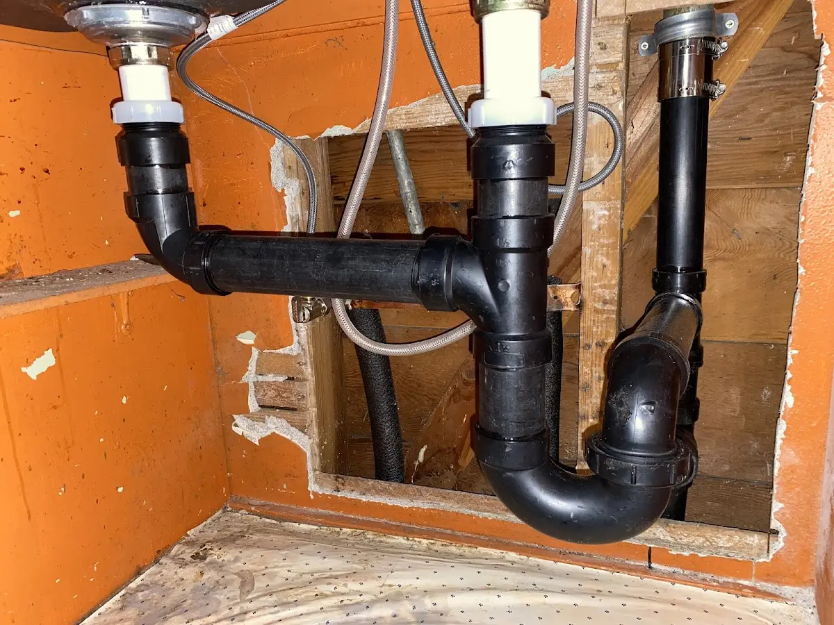 Professional Garbage Disposal Repair equipment and tools on the job in Whiteville
